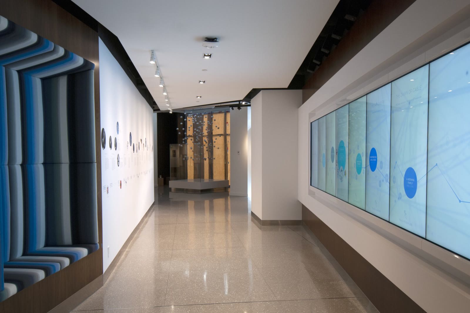 The eight-monitor timeline wall installed at the Shaw Family History Centre